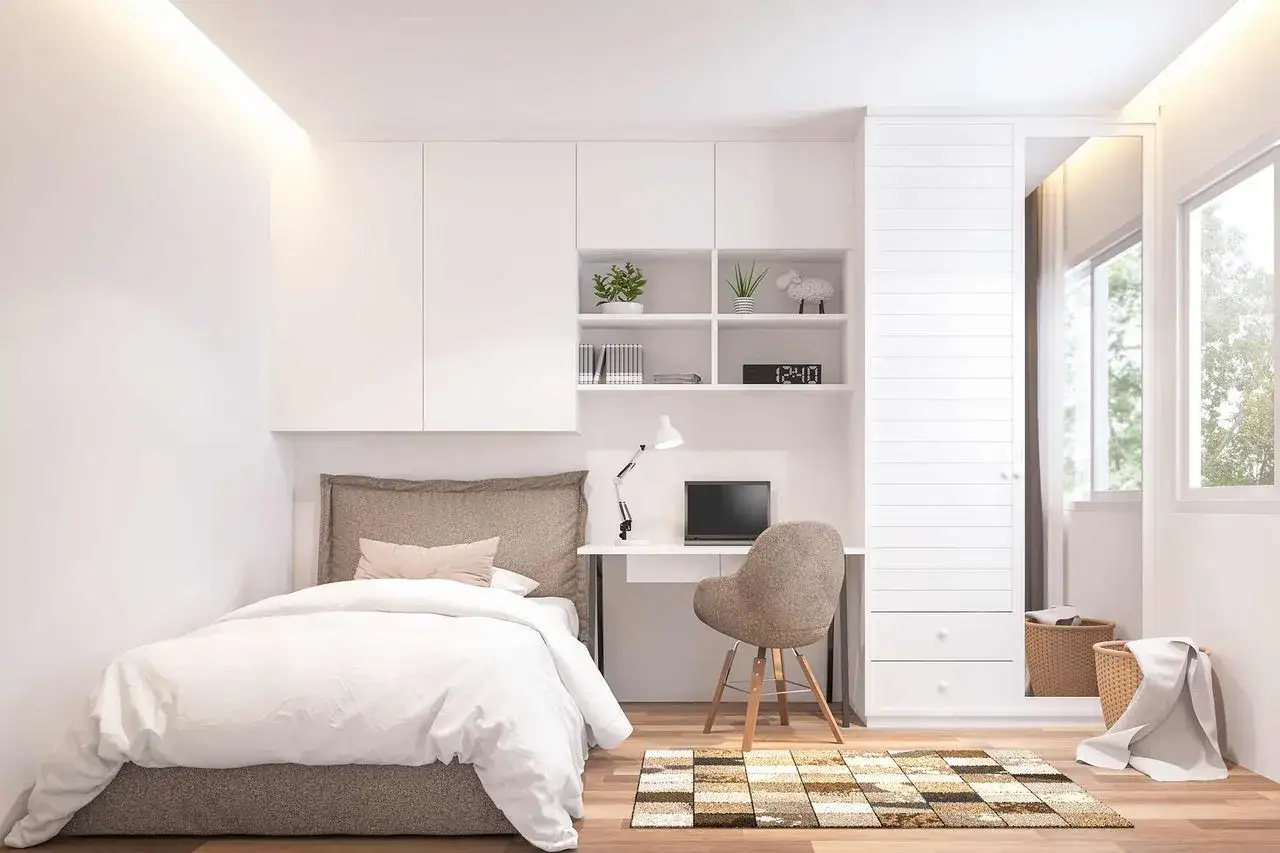 Modernes studentenzimmer einrichten: Bett, Schreibtisch mit Laptop, Regal und Schrank. Gemütlich und funktional.